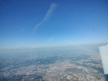 View of Linz while overhead the main Linz airport